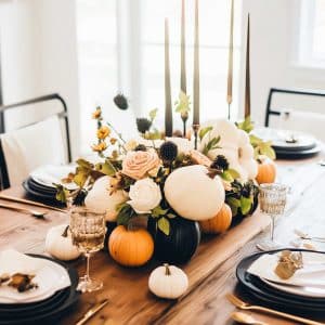 Your fall table called; it wants those white and orange pumpkins, flowers, and tall candles to move in. Cozy meets classy, with a slight pumpkin spice obsession.
