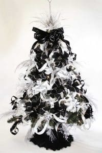 Behold the Christmas tree dressed like it's going to a monochrome gala, strutting silver bling with confidence that only comes from knowing it nailed the theme.