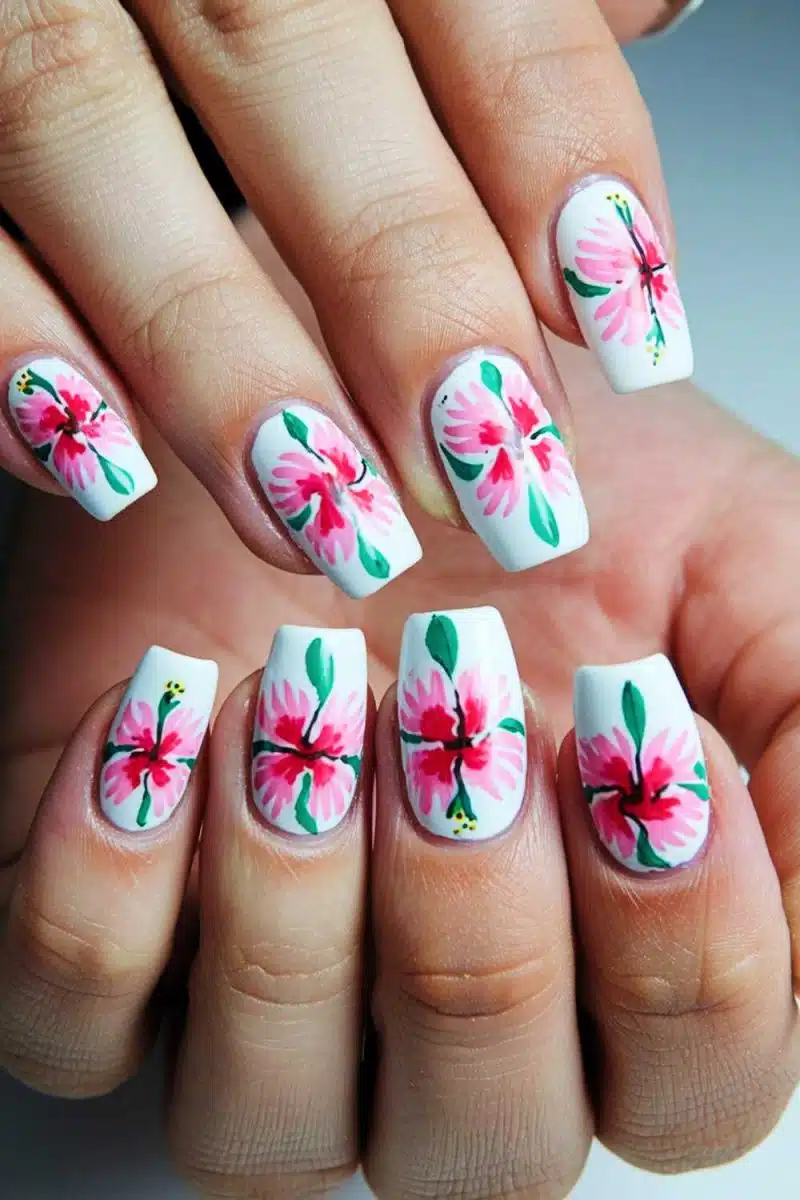 Oh, your nails are a garden party in bloom! Those hand-painted pink and green florals are like Monet on a manicure—an elegant rebellion against plain polish.