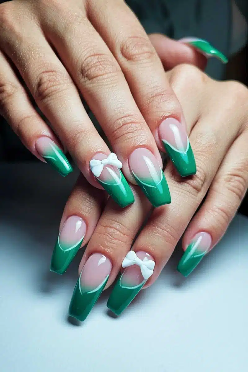 Its all about the nails, darling! Green French tips flaunting tiny white bows on the ring fingers. Whimsical vibes and a touch of fairy-tale whimsy!.