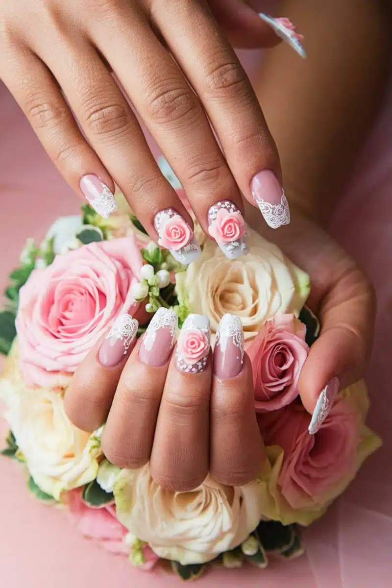 Floral nailed hands pulling a double duty makeover with pink and white roses. Nailed it! Who knew your hands could upstage your bouquet game?.