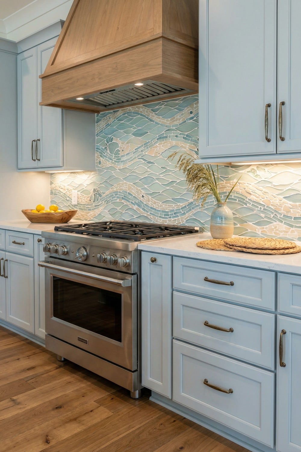 Flowing Mosaic Coastal Kitchen Backsplash and Oak Hood