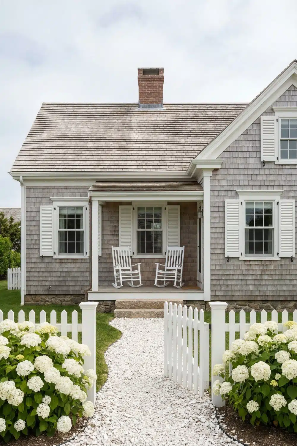 Cape Cod House Exterior with Brick Chimney and Rockers
